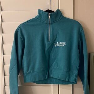 Cute teal zipper crop sweater with rodeo logo
